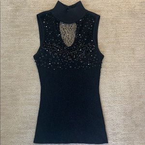 Sleeveless black top with sheer embellishment